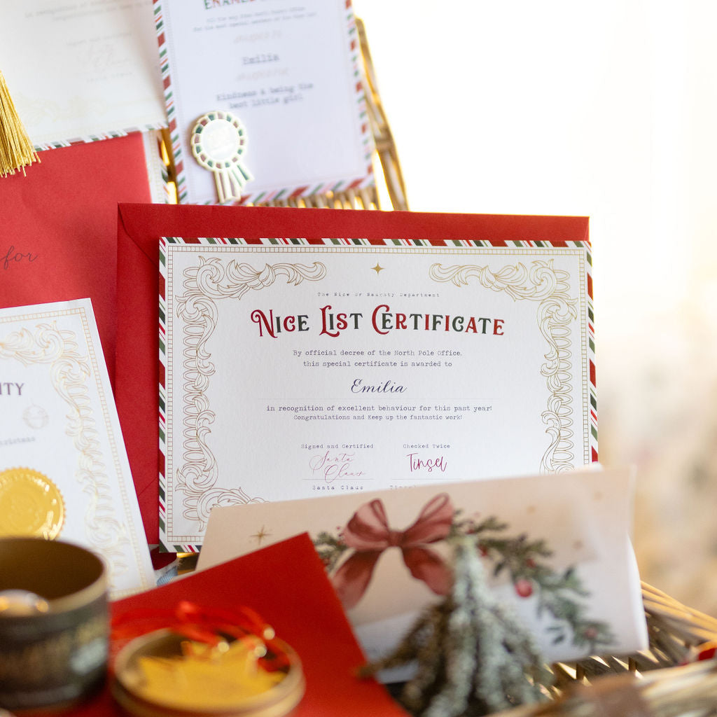 Basket with 'Nice List Certificate' and other festive items on a blurred background