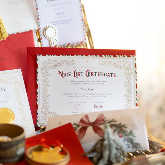 Basket with 'Nice List Certificate' and other festive items on a blurred background